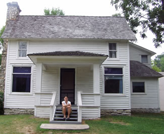 Jennie in front of the Laura Ingalls Wilder house in Mansfield, Missouri.